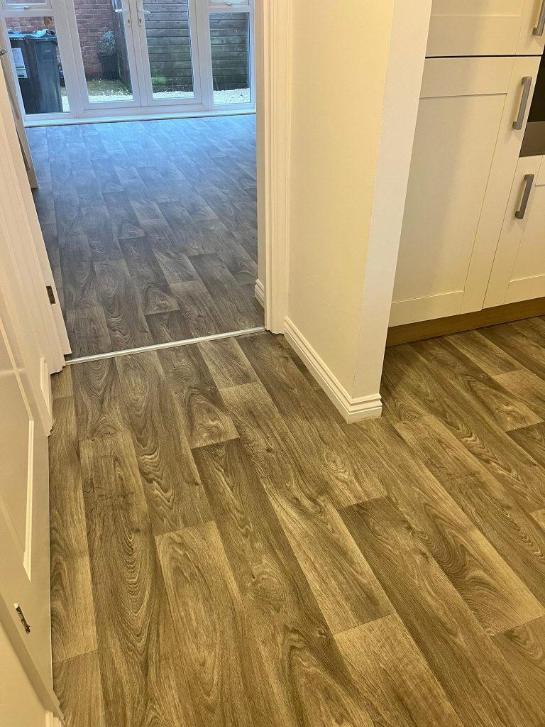 Rental property stairs and landing loop pile carpet grey wood effect vinyl floor 02