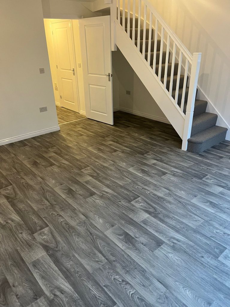 Rental property stairs and landing loop pile carpet grey wood effect vinyl floor 04