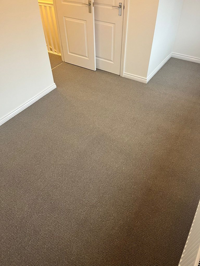 Rental property stairs and landing loop pile carpet grey wood effect vinyl floor 08