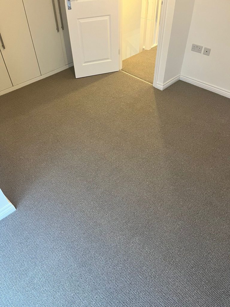 Rental property stairs and landing loop pile carpet grey wood effect vinyl floor 09