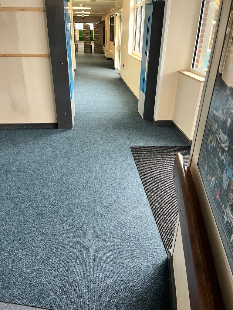 School work - Supa Cord commercial stick down carpet and 2 entrance mats.