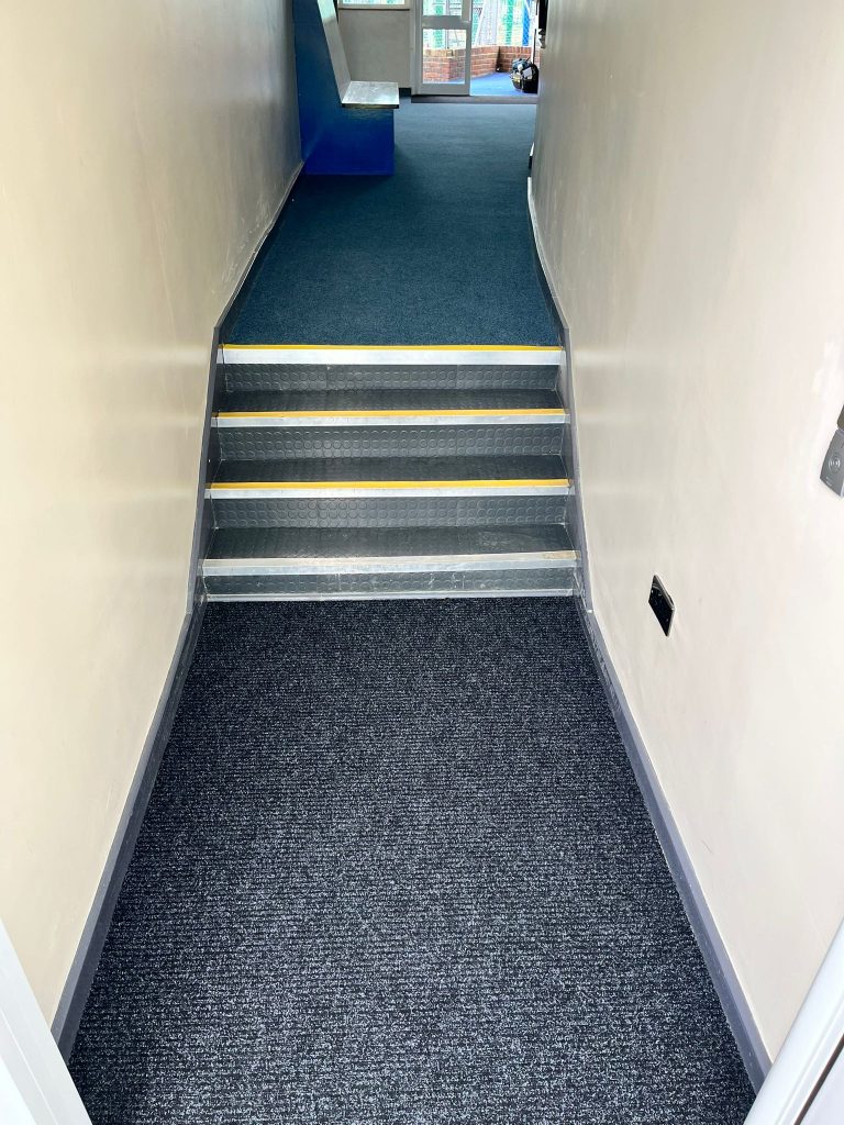 School work - Supa Cord commercial stick down carpet and 2 entrance mats.