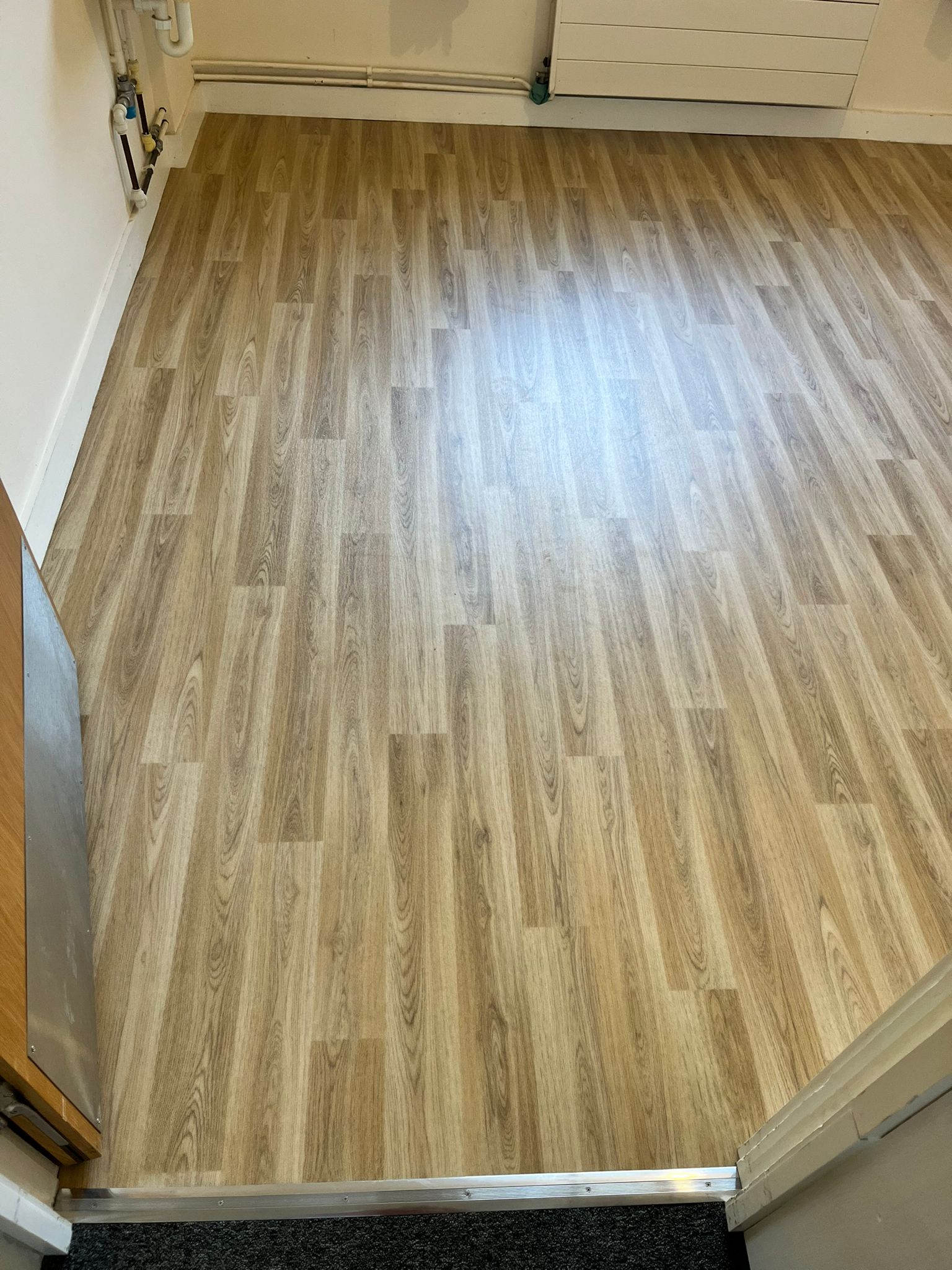 Nursing home residents room and sluice room supplied and fitted in Polysafe Wood FX safety flooring
